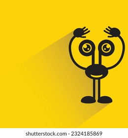 funny monster with shadow on yellow background