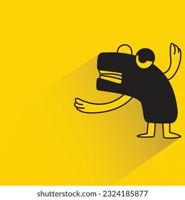 funny monster with shadow on yellow background