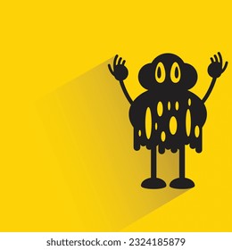 monstruo gracioso con sombra sobre fondo amarillo