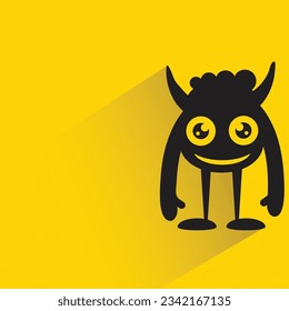 funny monster with shadow on yellow background