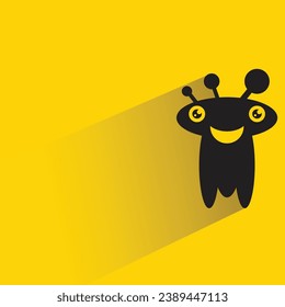 funny monster with shadow on yellow background