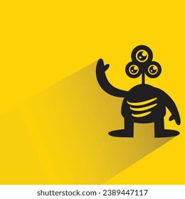 funny monster with shadow on yellow background
