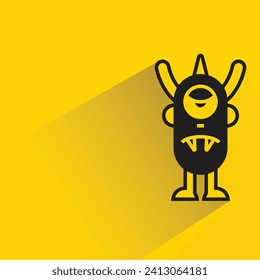monstruo gracioso con sombra sobre fondo amarillo