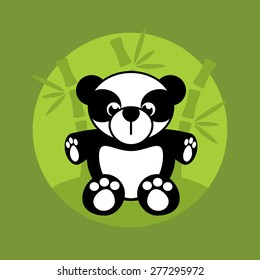 Funny panda sits in the bamboo thickets