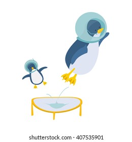 Funny penguins in helmets from the  spacesuit jumping on a trampoline.