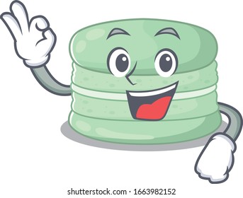 A funny picture of pistachio macaron making an Okay gesture