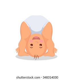 Funny playing baby standing on his head. Little cute baby playing upside down.  Isolated kid on the white background.