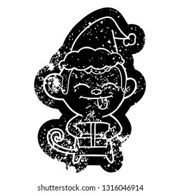 funny quirky cartoon distressed icon of a monkey with christmas present wearing santa hat