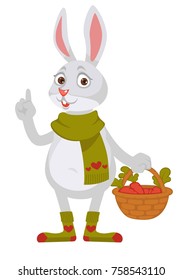 Funny rabbit in knitted scarf and socks holds wicker basket