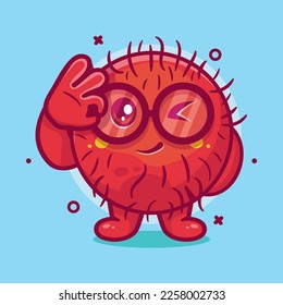 funny rambutan fruit character mascot with ok sign hand isolated cartoon in flat style design