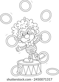 Funny red circus clown balancing on a big drum and juggling with toy hoops in a fun performance, black and white vector cartoon illustration for a coloring book