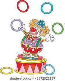 Funny red circus clown balancing on a big drum and juggling with colorful toy hoops in a fun performance, vector cartoon illustration on a white background