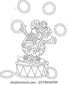 Funny red circus clown balancing on a big drum and juggling with toy hoops in a fun performance, black and white vector cartoon illustration for a coloring book