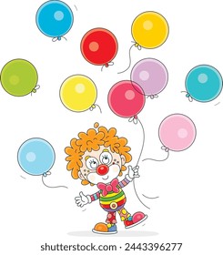 Funny red curly-headed circus clown playing with multi colored holiday balloons in a fun performance, vector cartoon illustration on a white background