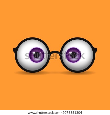 Funny round eyeglass frame and eyeballs with colored irises instead of lenses over bright background. Concept of vision correction using glasses, healthy vision
