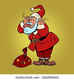 Funny Santa Claus with a bag of gifts makes funny faces