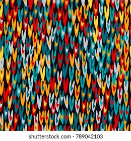 Funny seamless pattern with crude rows of multicolored hearts. St. Valentine's Day texture. Blue, red, yellow colors.