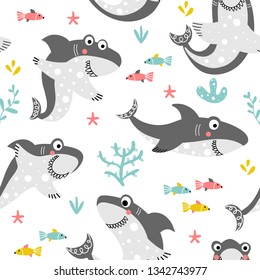 Funny seamless pattern with friendly smiling sharks and fishes on a white background with sea plants in a cartoon style. Illustration for children in vector.