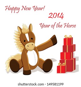 Funny smiling horse toy made of fabric as a symbol of new year