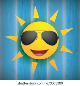 Funny sun face with sunglasses on the blue wooden background.  Eps 10 vector file.