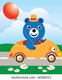 Funny teddy bear in a yellow hat, rides in a car on the road