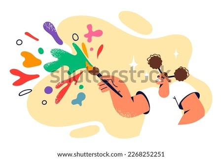 Funny teenage girl wants to become artist uses brush to paint. Schoolgirl with pigtails with brush and colorful splashes flying in different directions symbolizes development creativity in children 