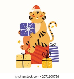 Funny tiger in a Santa Claus hat sits on a big pile of Christmas gifts. Symbol of 2022 Chinese year of tiger. Happy New Year and Christmas. Cartoon animal character. Hand drawn vector illustration