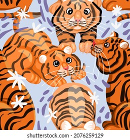 Funny tigers vector seamless pattern. Wild cats colored modern ornament. Eastern calendar symbol of the year. Design for fabric, textile, background, wallpaper, decor.