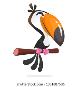 Funny toucan cartoon. Vector toucan bird sitting on the branch. Illustration isolated