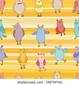 Funny vector seamless pattern. Cartoon color owls on striped background. Ideal for textile, wallpaper, wrapping.