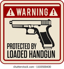 funny warning sign. protected by handgun.