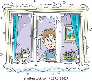 Funny Young Man With His Cat Going To Walk And Looking Out Of A Snowy Window With A Thermometer On A Frosty Winter Day, Vector Cartoon Illustration On A White Background