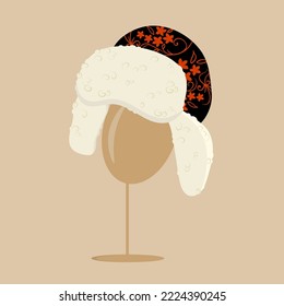 Sheep’s fur cap with ear flaps and floral pattern on the stand. Cartoon vector illustration.
