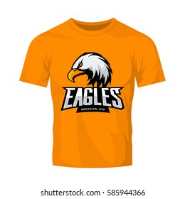 Furious eagle sport vector logo concept isolated on orange t-shirt mockup. Modern web infographic New York Brooklyn team pictogram. Premium quality wild bird t-shirt tee print illustration.