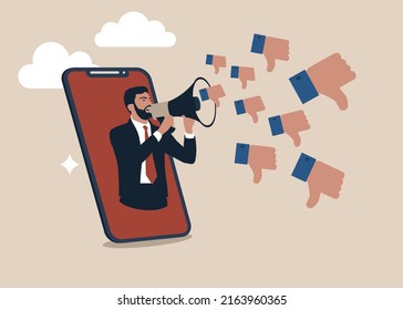 Furious Man From Smartphone Shouting On Megaphone With Negative Thumb Down Symbols. Internet Hater, Angry Social Media, Dislike Or Negative Feedback From Remote Work, Cyber Bullying Concept.