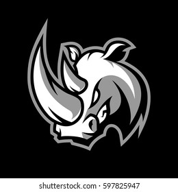 Furious rhino sport vector logo concept isolated on dark background. Professional team badge design. Premium quality wild animal t-shirt tee print illustration.