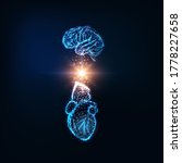 Futuristic emotional intelligence concept with glowing low polygonal human brain and heart and light energy between them isolated on dark blue background. Modern wire frame design vector illustration.