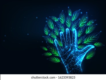 Futuristic environmental responsibility concept with glowing low polygonal tree made of human hand and green leaves on dark blue background. Modern wire frame mesh design vector illustration.