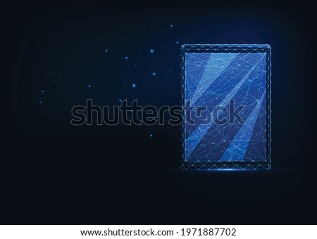 Futuristic glowing low polygonal front view of digital tablet isolated on dark blue