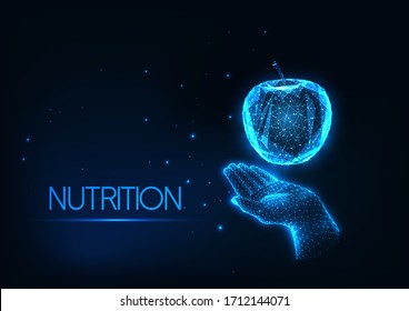 Futuristic healthy diet, nutrition concept with glowing low polygonal human hand holding an apple isolated on dark blue background. Modern wire frame mesh design vector illustration. 