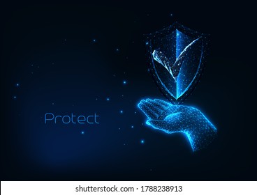 Futuristic protection cyber security concept with glowing low polygonal human hand holding protective shield isolated on dark blue background. Modern wire frame mesh design vector illustration. 