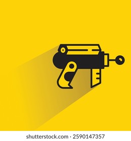 futuristic and space gun icon with shadow on yellow background