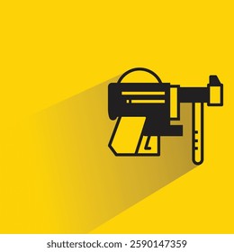 futuristic and space gun icon with shadow on yellow background
