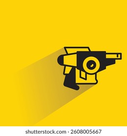 futuristic and space gun icon with shadow on yellow background