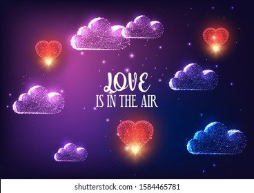 Futuristic Valentines day banner concept with glowing low polygonal clouds, red flying hearts and text Love is in the air on dark purple background. Modern wire frame mesh design vector illustration.