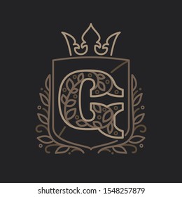 G letter logo consisting of floral pattern letters in a heraldic shield with crown. Can be used for security, hotel, resort, restaurant, boutique, jewelry, interior and fashion industry.