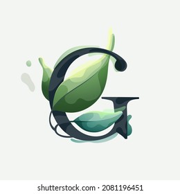 G letter logo with green leaves in clear vector watercolor style. Serif sans font for luxury emblem, botanical identity, ecology projects, wedding invitations.