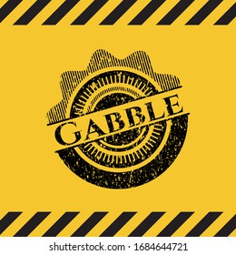 Gabble black grunge emblem inside yellow warning sign. Vector Illustration. Detailed.
