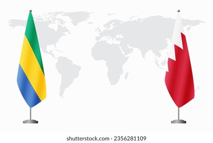 Gabon and Bahrain flags for official meeting against background of world map.