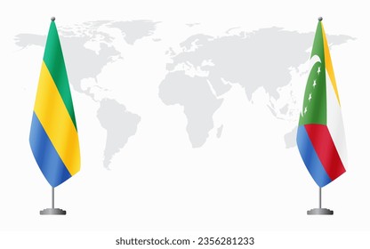 Gabon and Comoros flags for official meeting against background of world map.